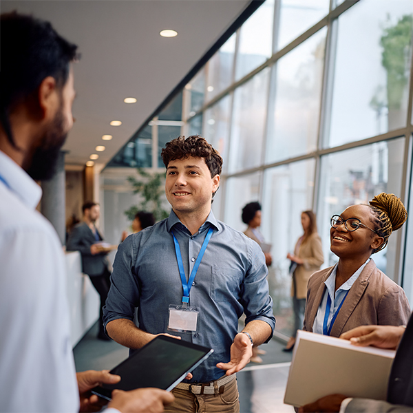 Professionals talk at a trade show