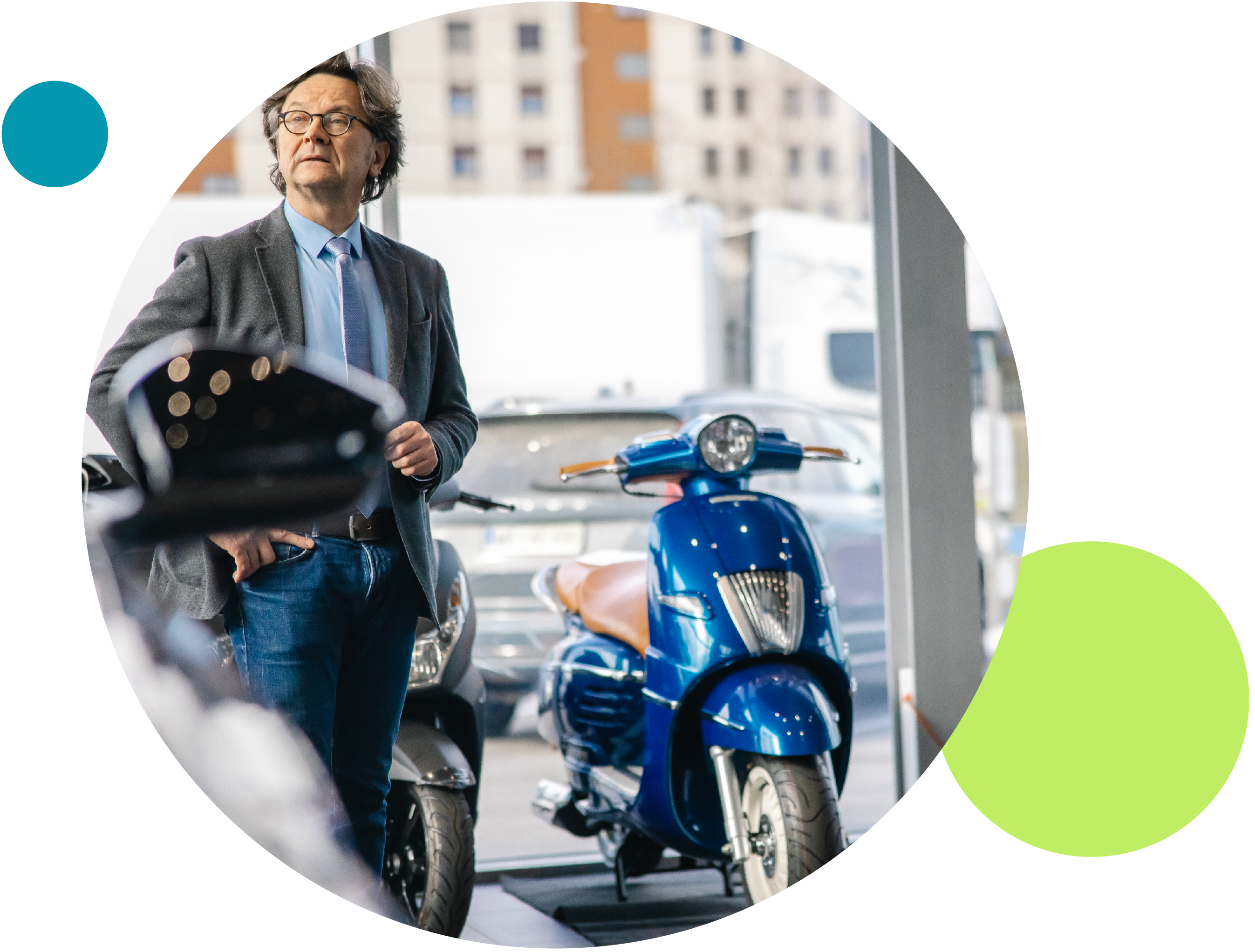 A man beside a motorcycle in a showroom