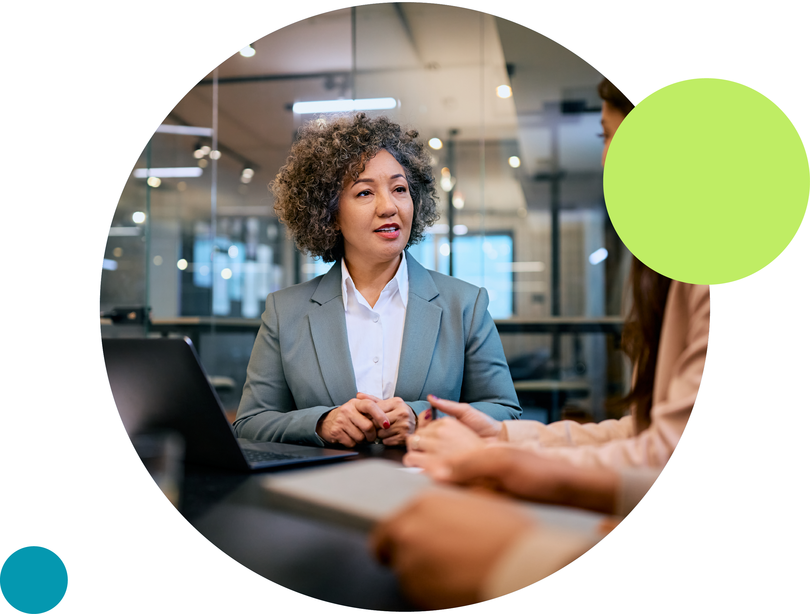 A professional woman speaks to clients