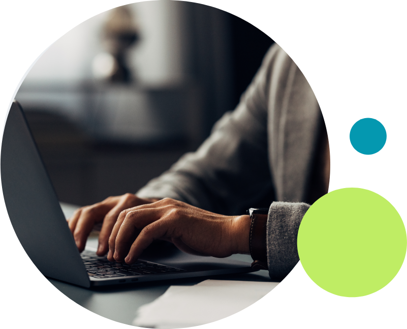 A man typing on a laptop