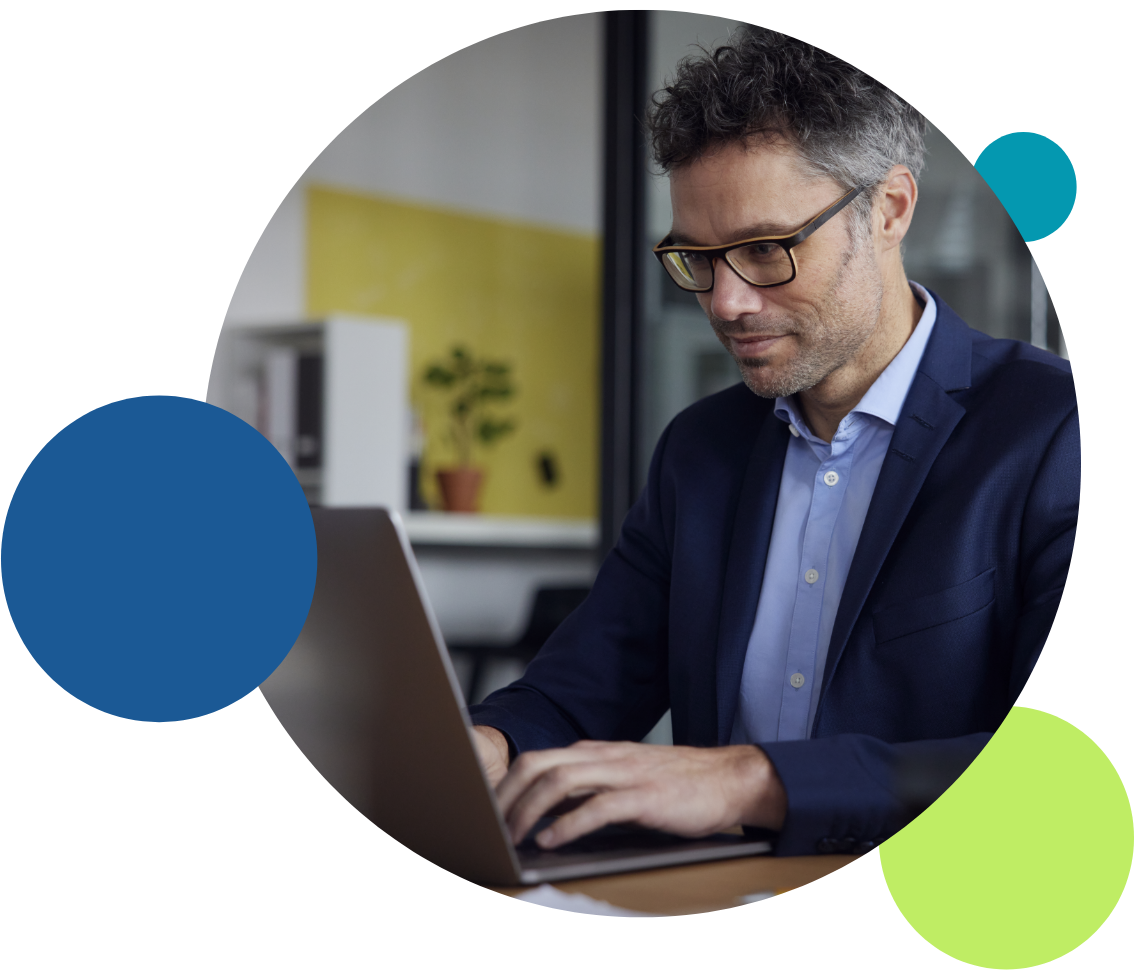 A business man works on a laptop